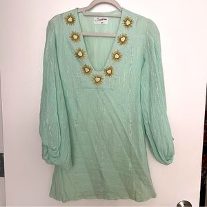 mini sundress with ornate detail and pouf sleeves